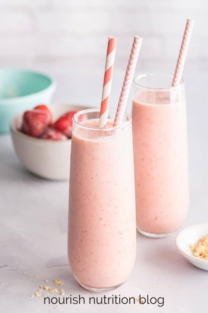 strawberry banana peanut butter smoothies on a table with text overlay