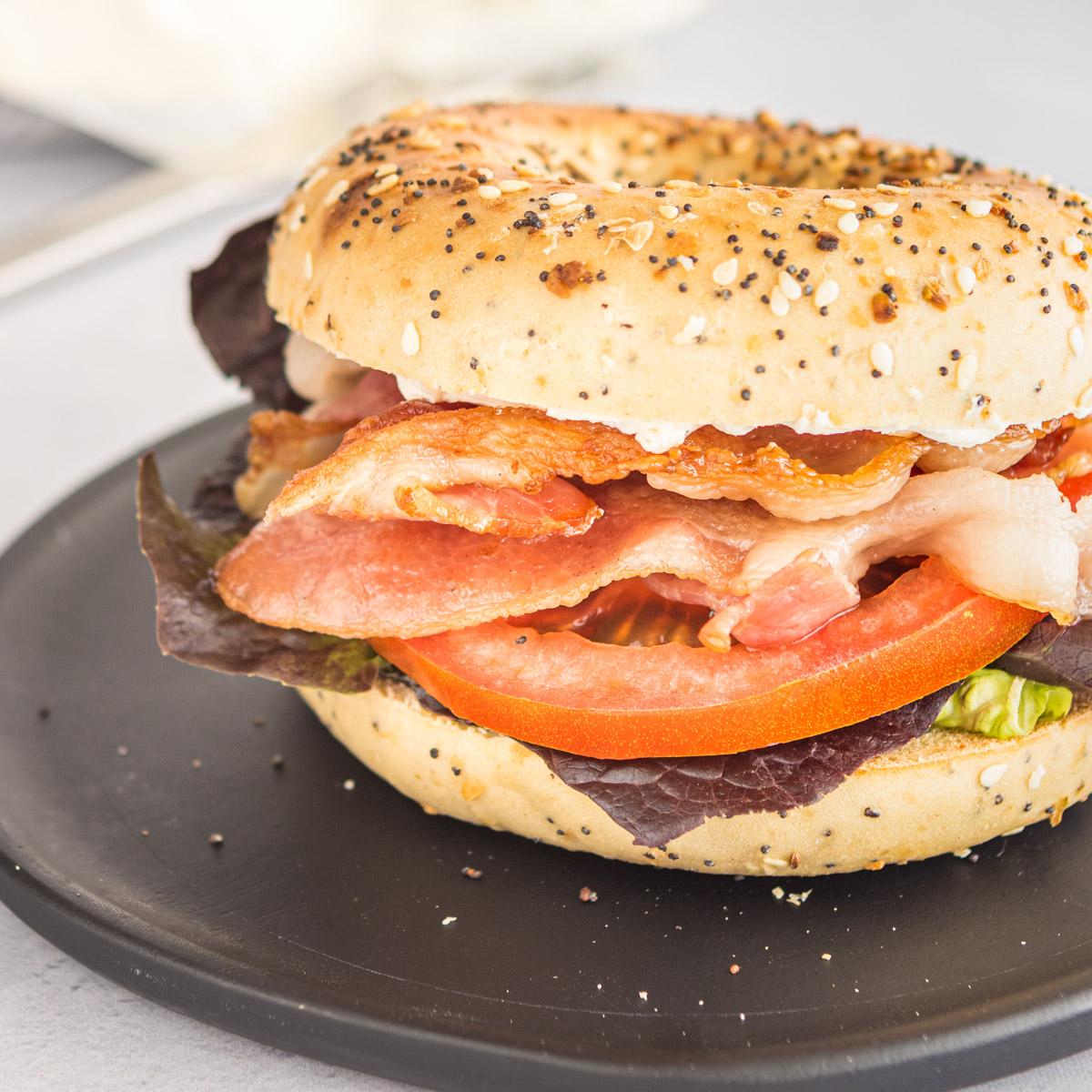 close up of a blt on an everything bagel