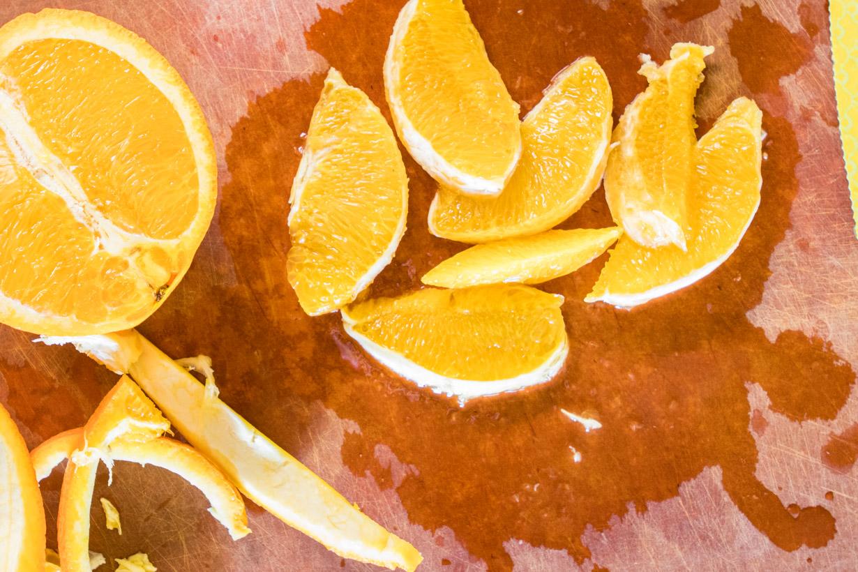 orange slices on a cutting board