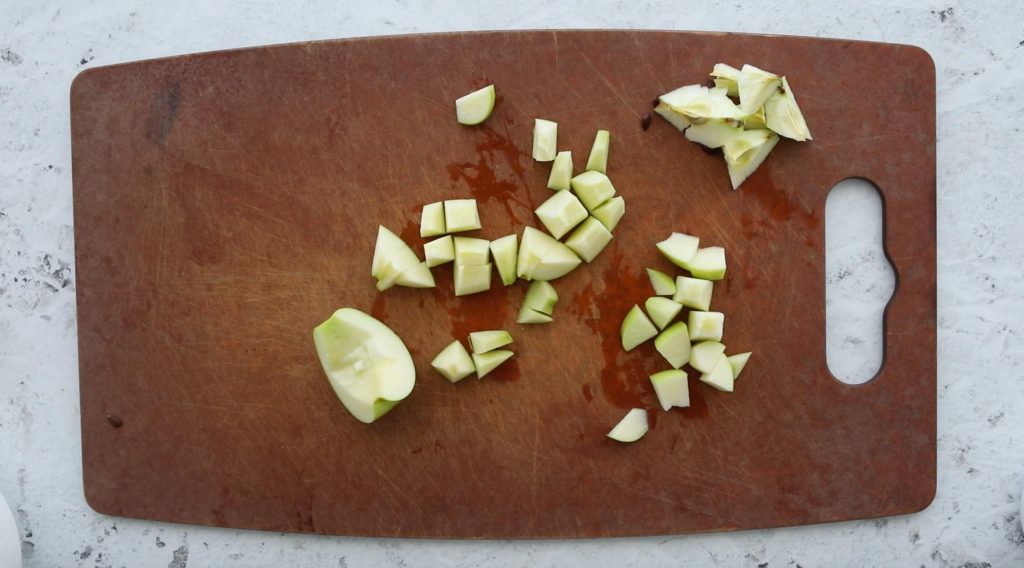 chopped granny smith apple on cutting board