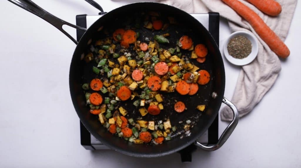 vegetables cooking in a large saucepan