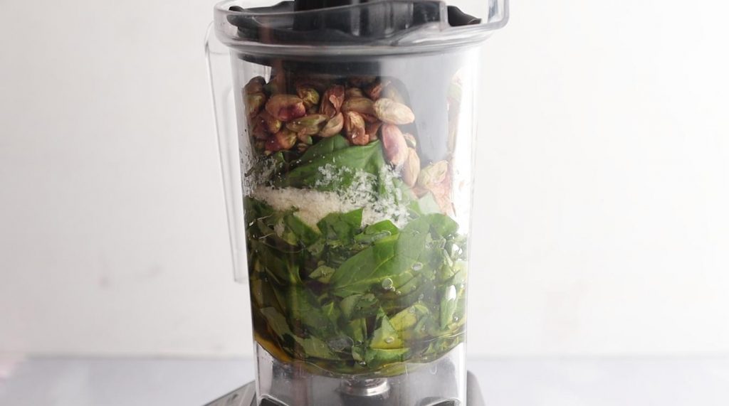 ingredients for pesto in a blender  jar