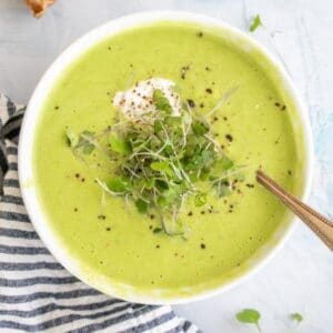asparagus soup with micro greens and pepper on top