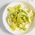 shaved zucchini, corn, and feta salad in a bowl
