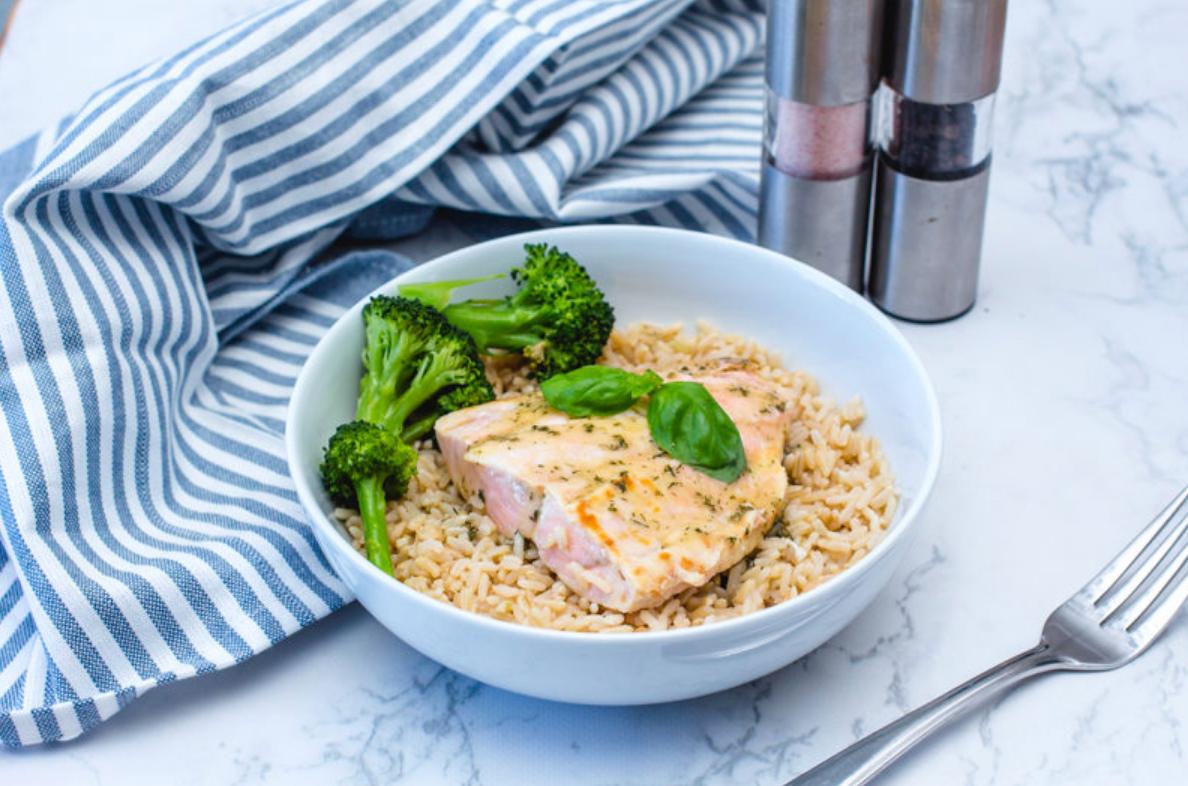 salmon over rice with broccoli in a bowl