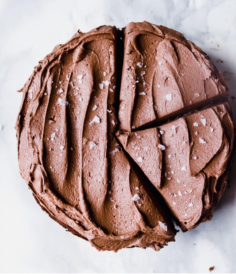 chocolate frosted cake with 2 slices cut out