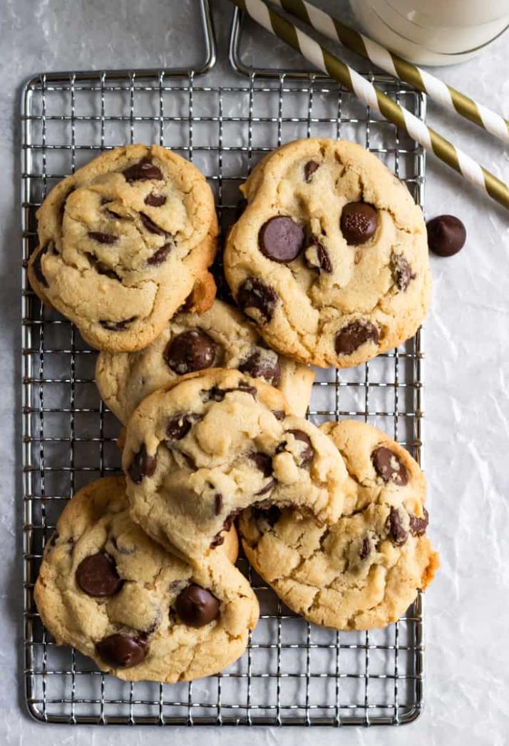 pile of chocolate chip cookies on a cooling rack