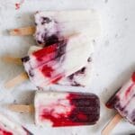 pile of berry and yogurt popsicles on a table