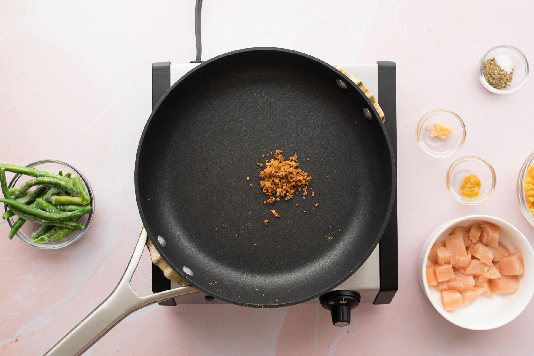 breadcrumbs cooking in a skillet