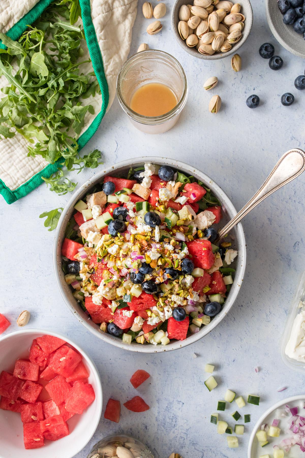 watermelon chicken and blueberry salad in a large bowl