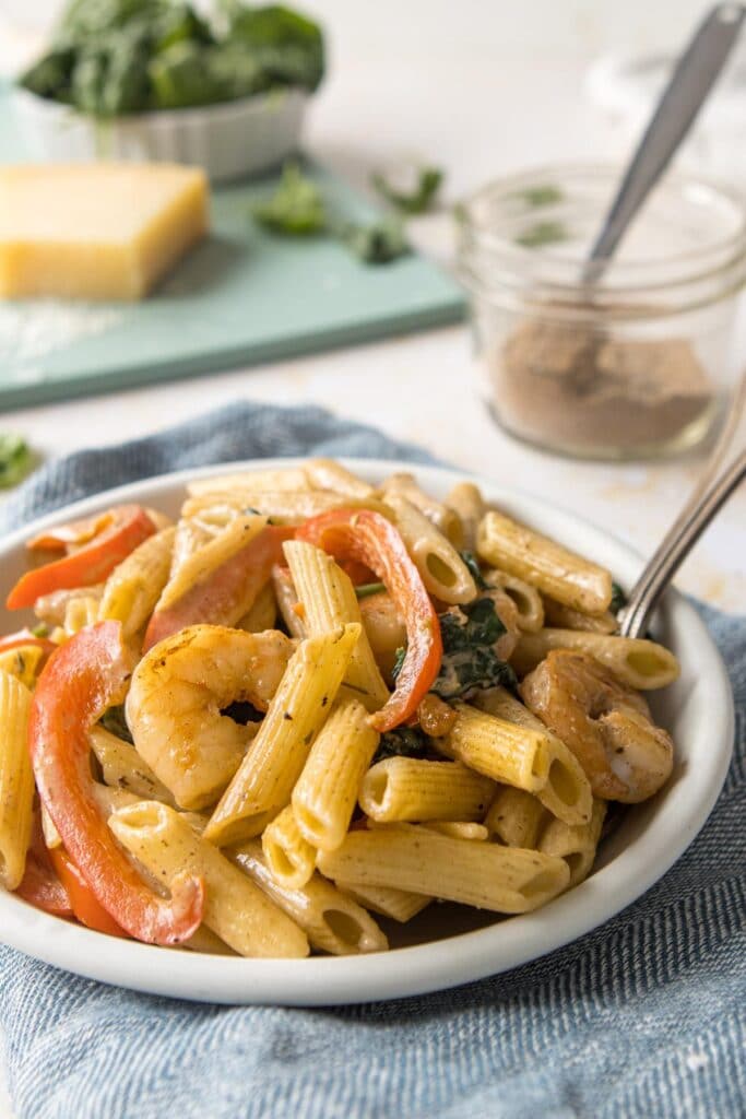 close up of jerk shrimp pasta in a bowl