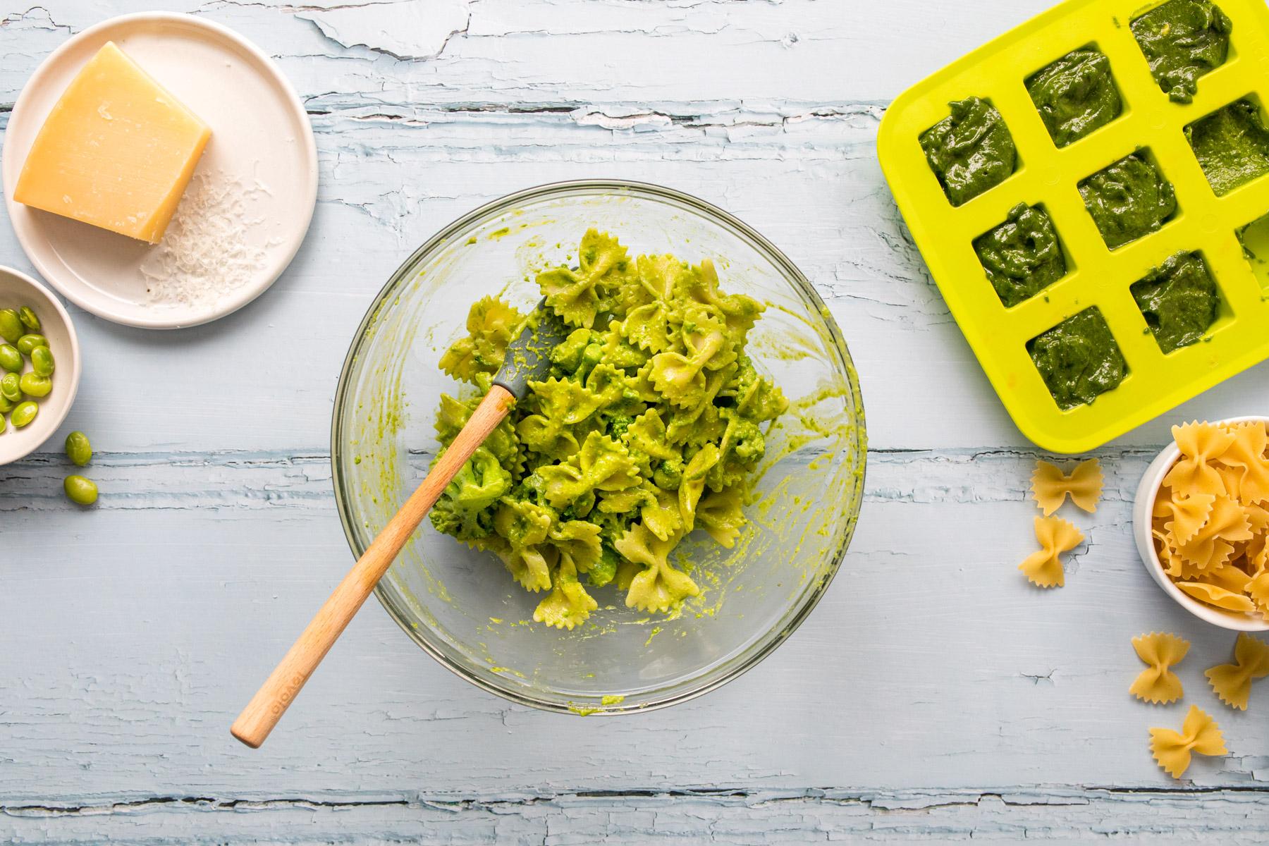 bow tie pasta with pesto in a glass bowl