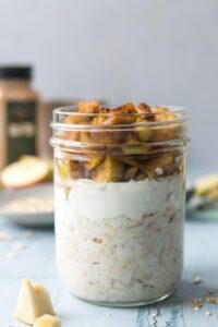 Jar full of oats, yogurt, and cooked apples