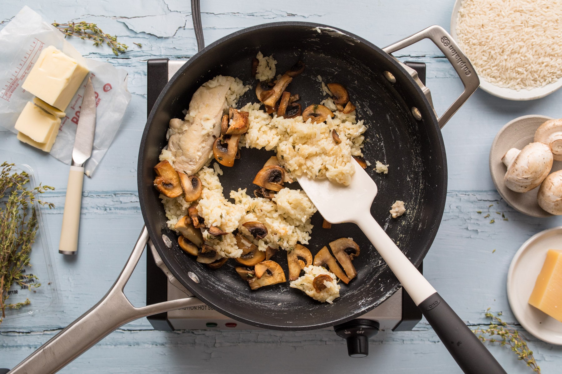 skillet with cooked rice and mushrooms in it