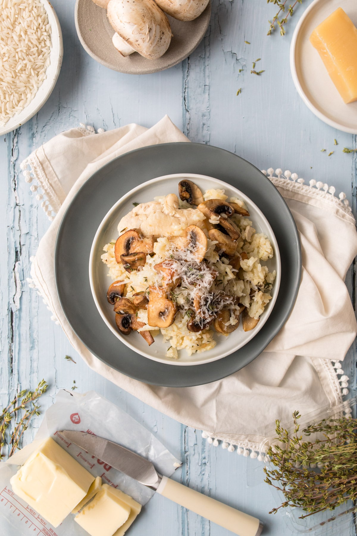 mushrooms and chicken over rice on a table