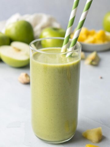 close up of green smoothie in glass