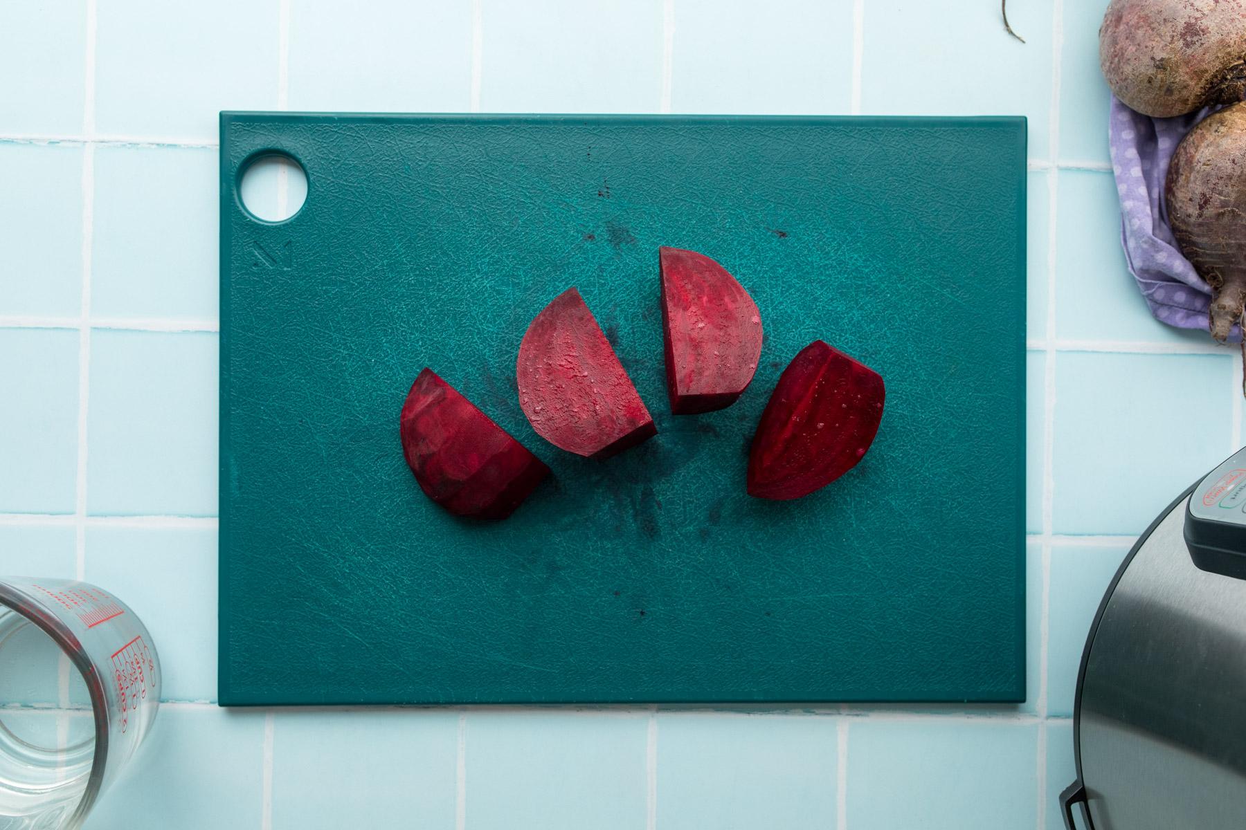 quartered beet on cutting board
