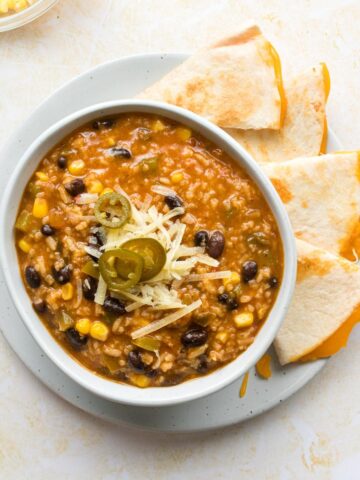 close up of tortilla soup with cheese