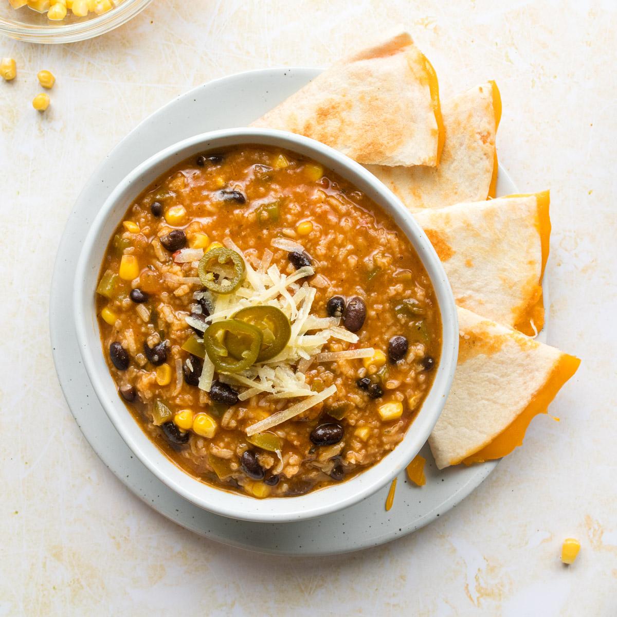 close up of tortilla soup with cheese