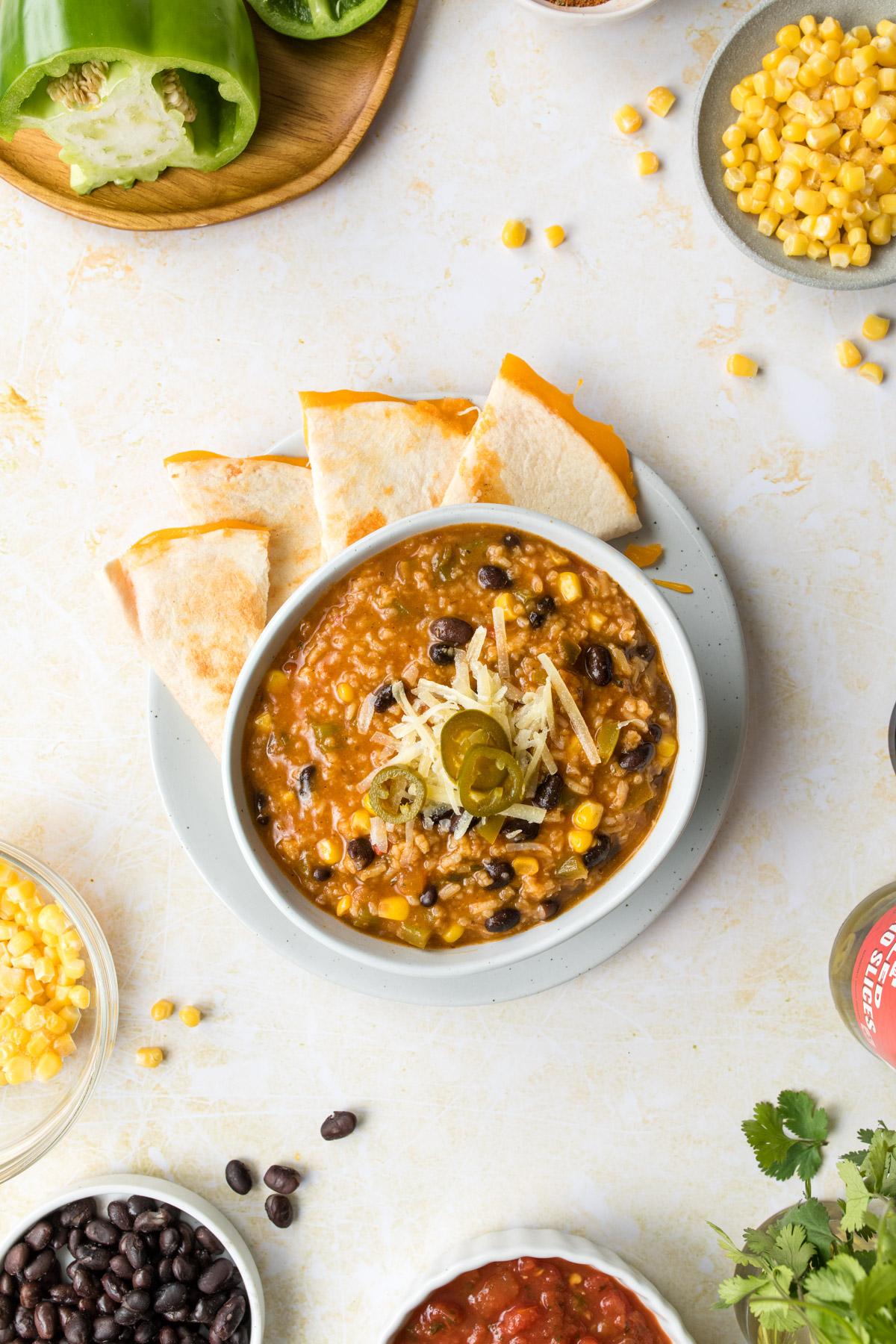 tortilla soup with quesadilla on table