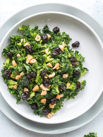 square image of kale salad in a bowl