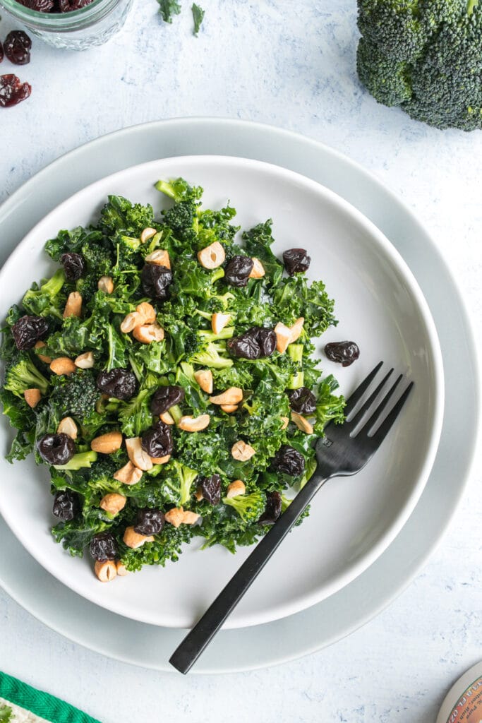 kale salad with fork on a plate