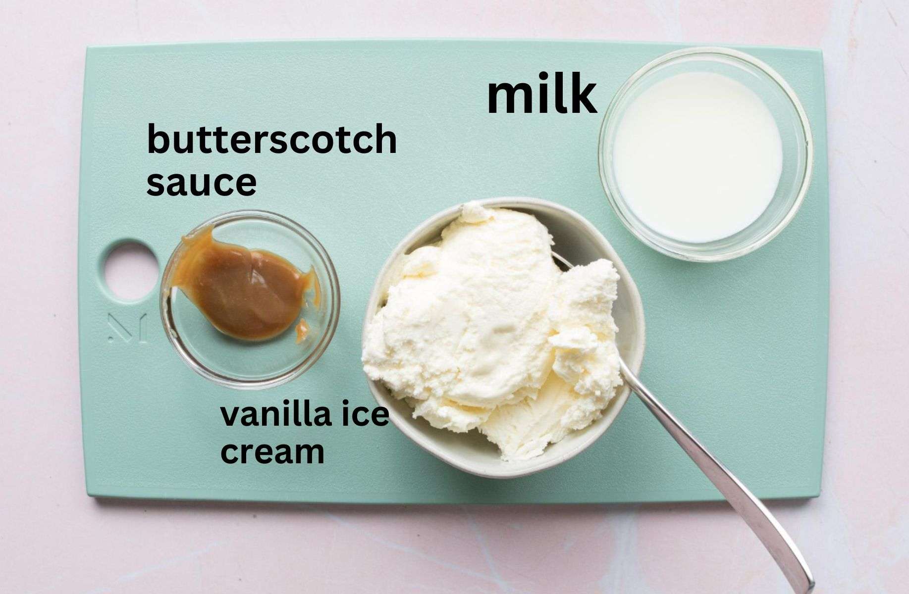 caramel, ice cream, and milk on cutting board