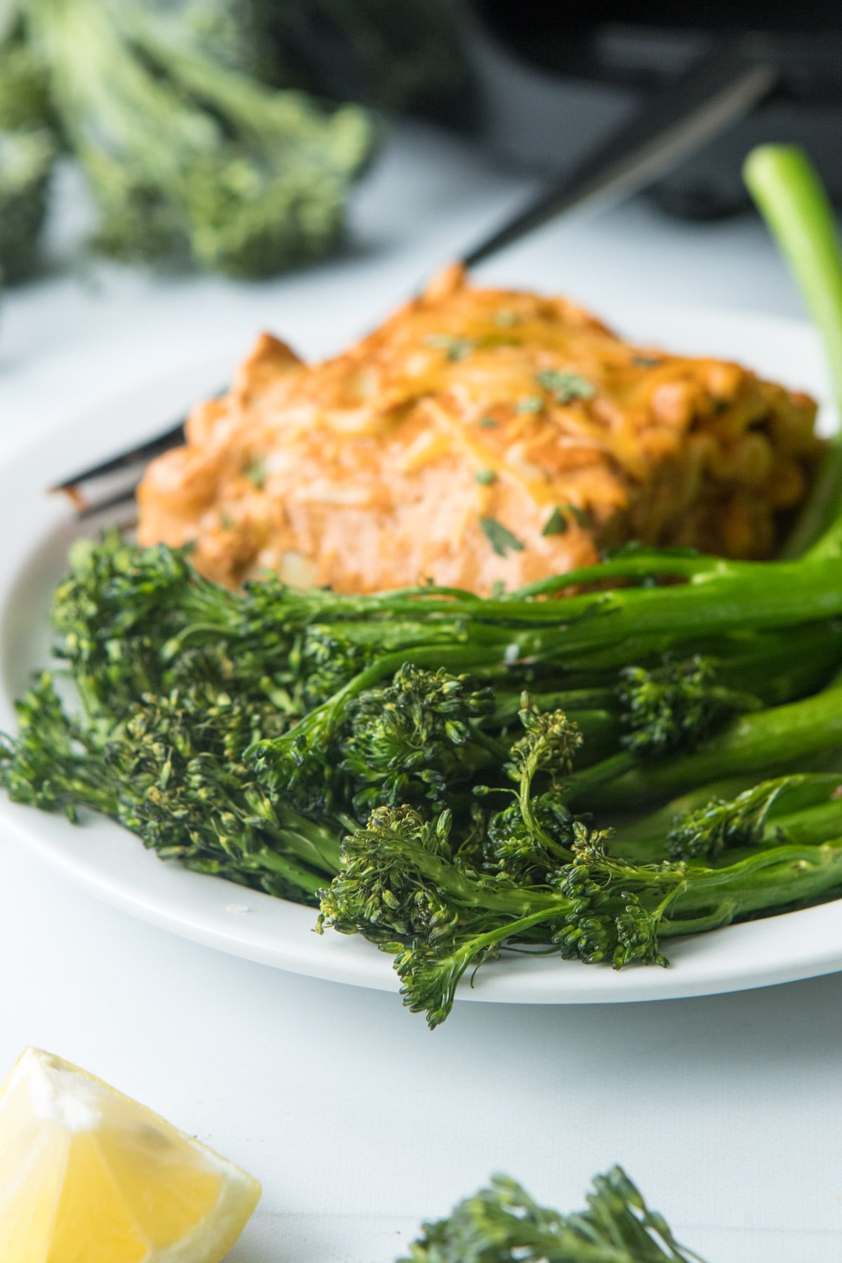 broccolini on plate with lasagna