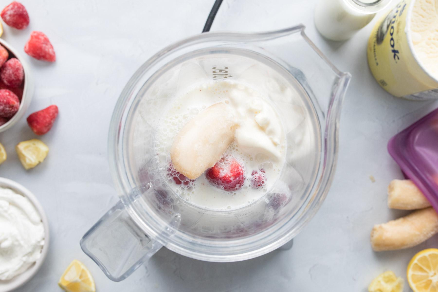 banana, strawberry, milk in blender