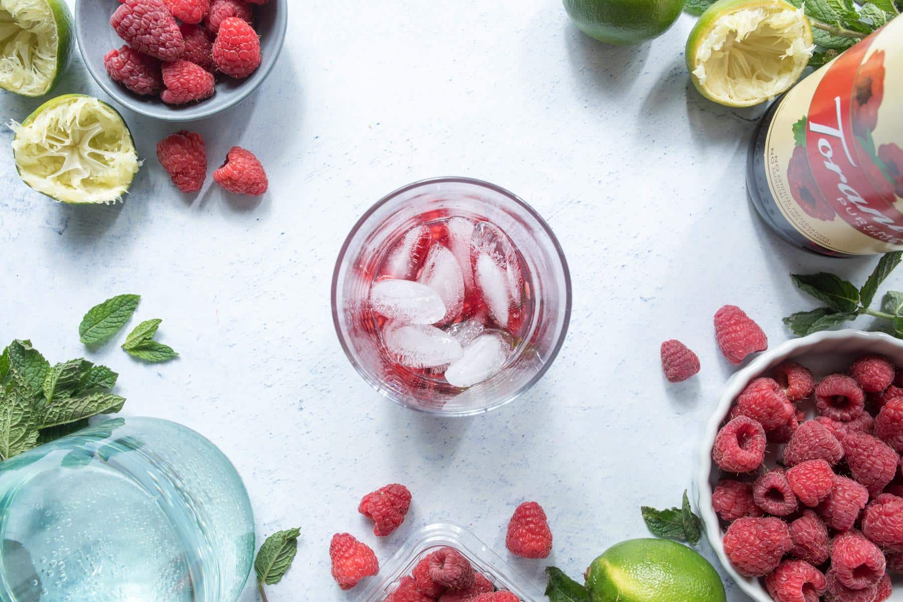 raspberries with ice in glass