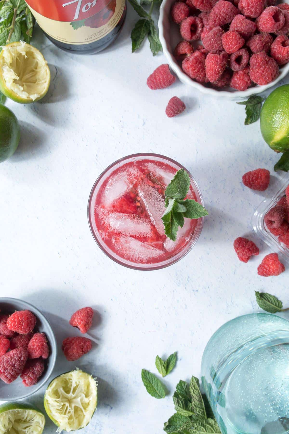 pink drink with ice and mint on table