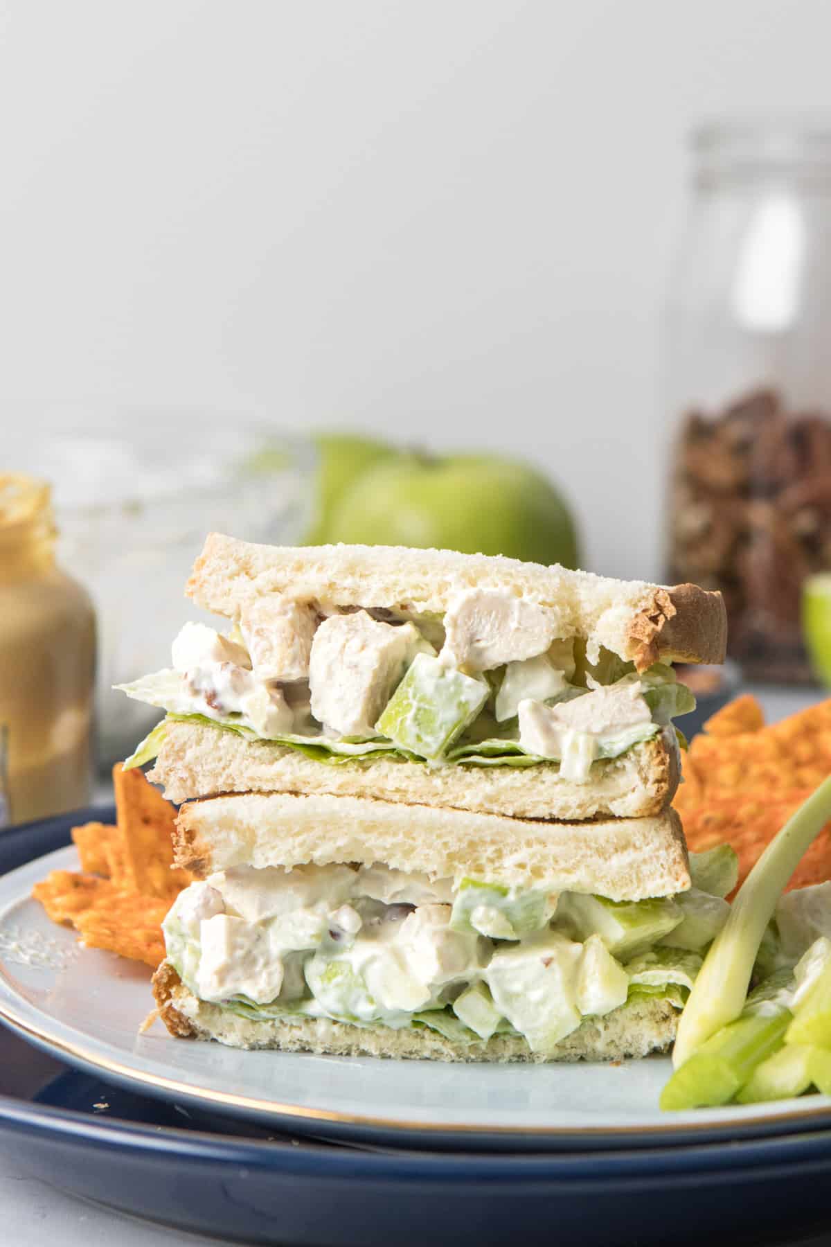 stacked chicken salad sandwich on plate