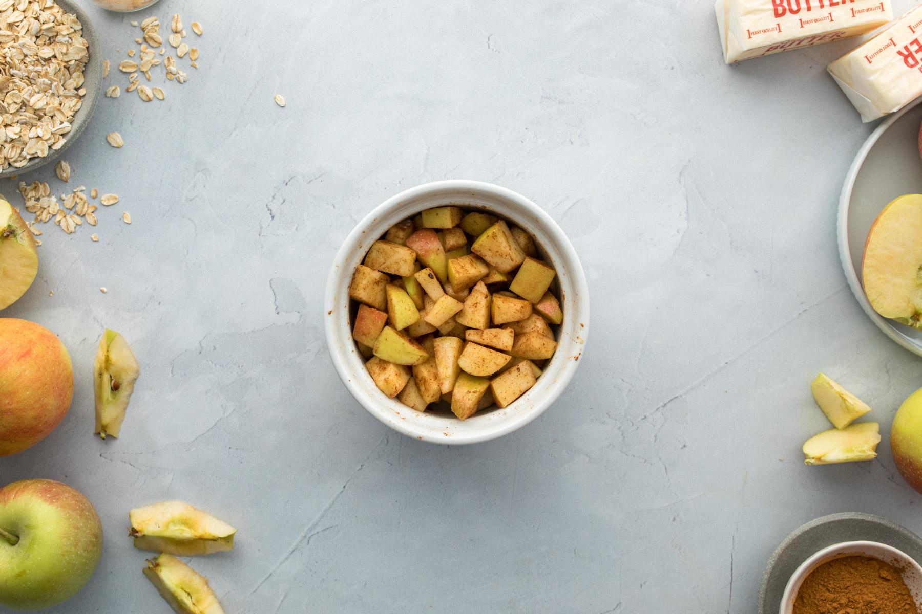 white bowl full of seasoned apples