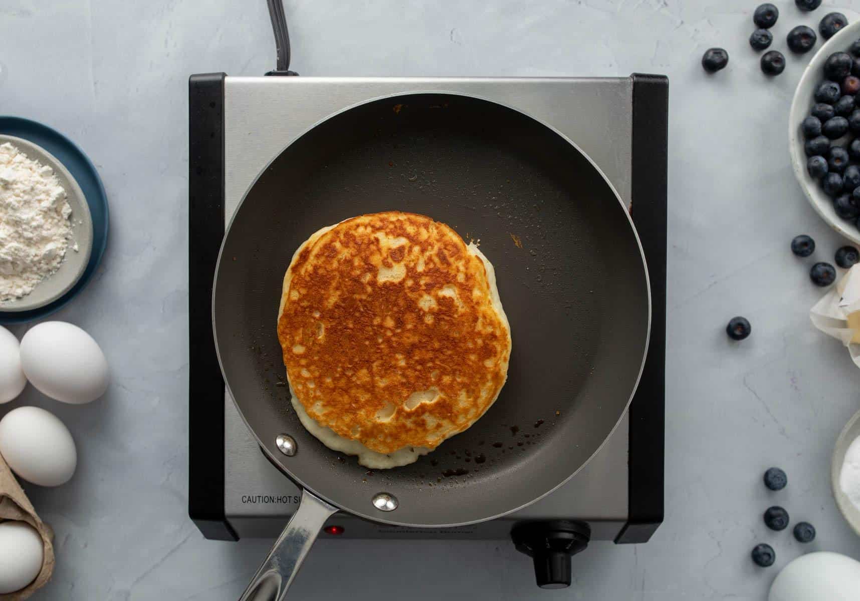 browned pancake in pan