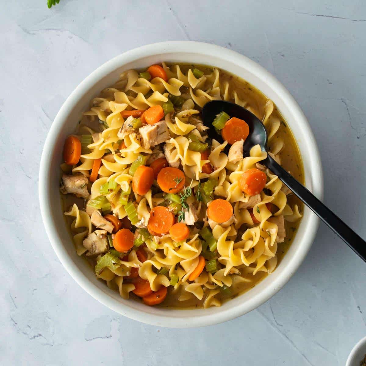 bowl of egg noodles, carrots in bowl