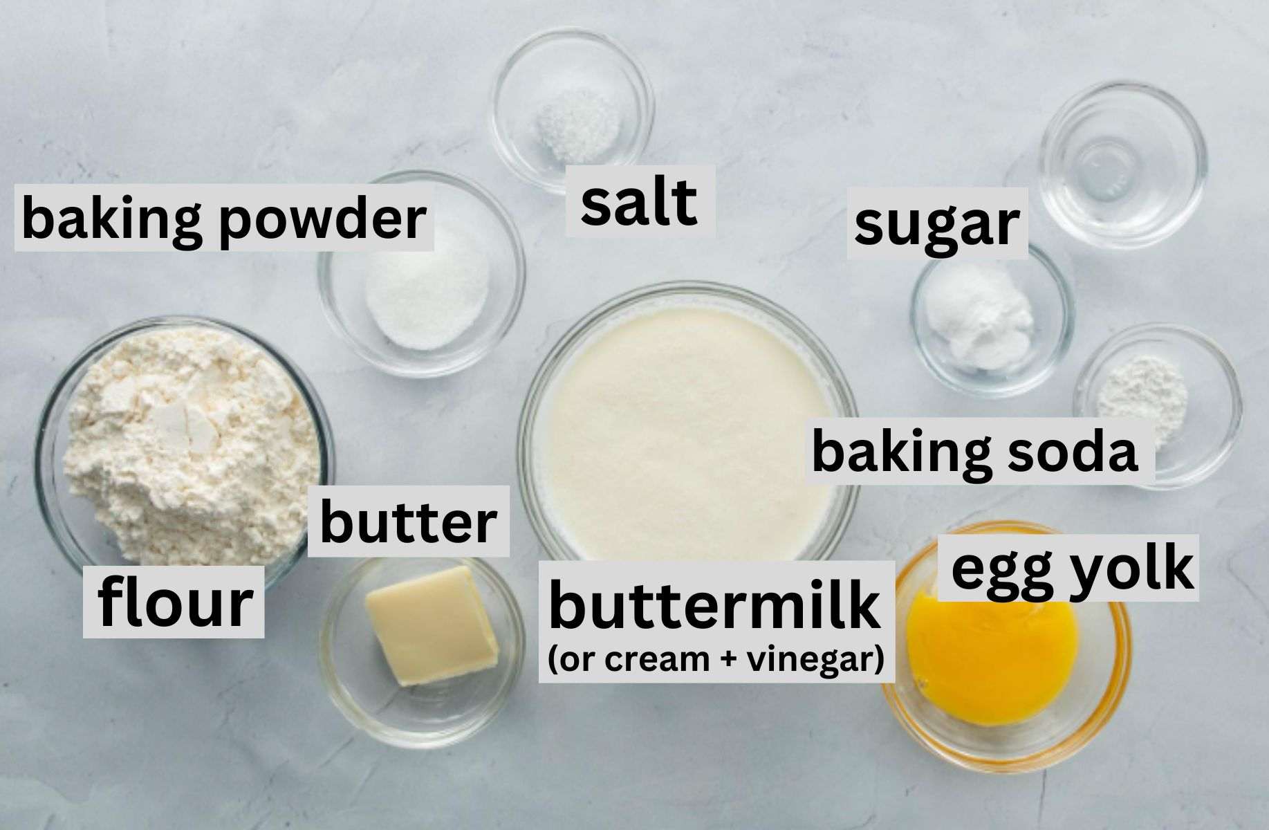 cream, flour, baking ingredients in bowls