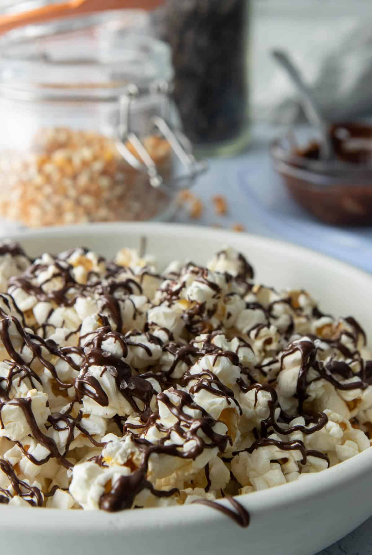popcorn with chocolate drizzle in bowl