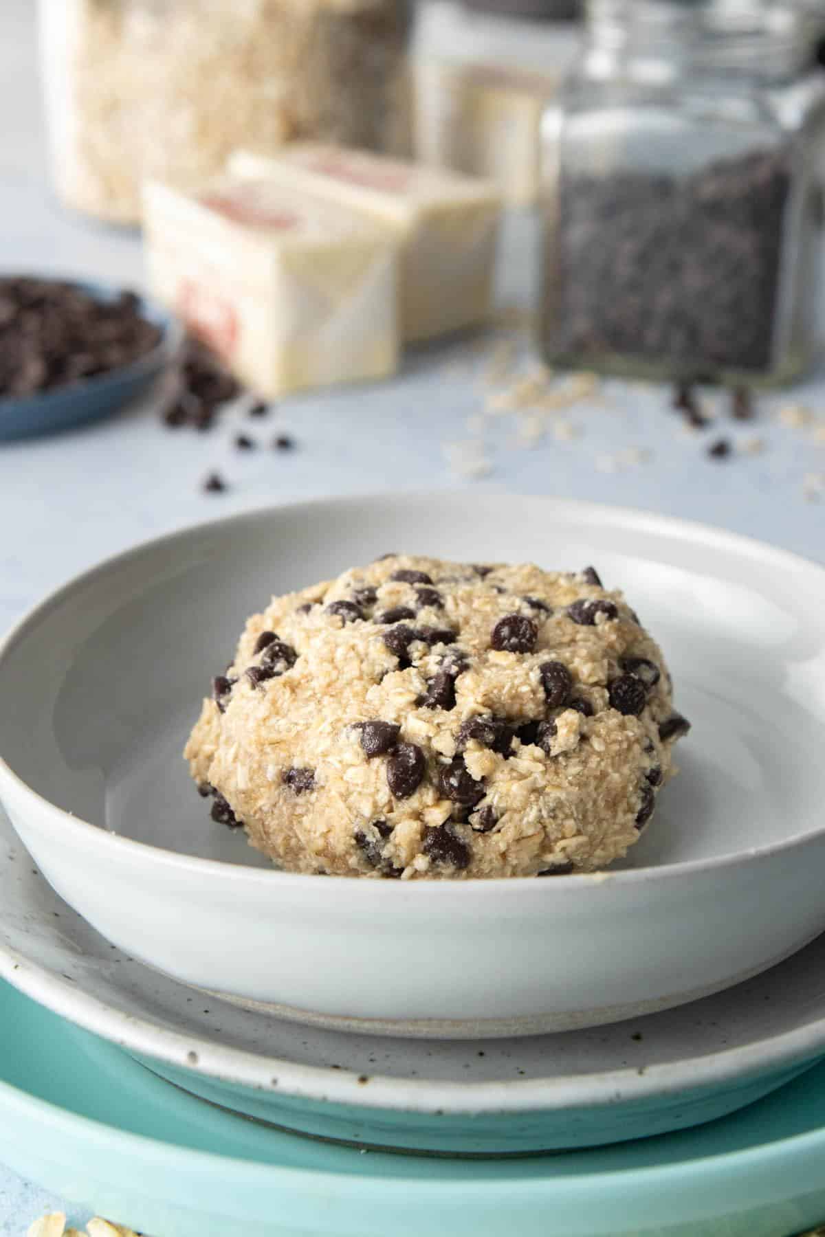 chocolate chip cookie dough on stack of plates