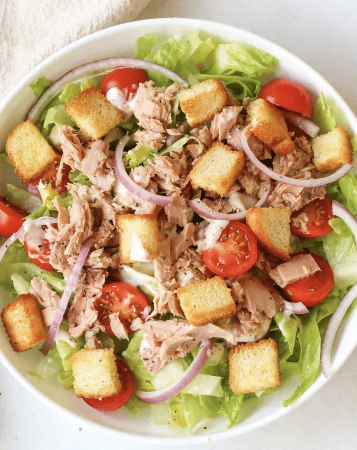 canned tuna on salad with croutons