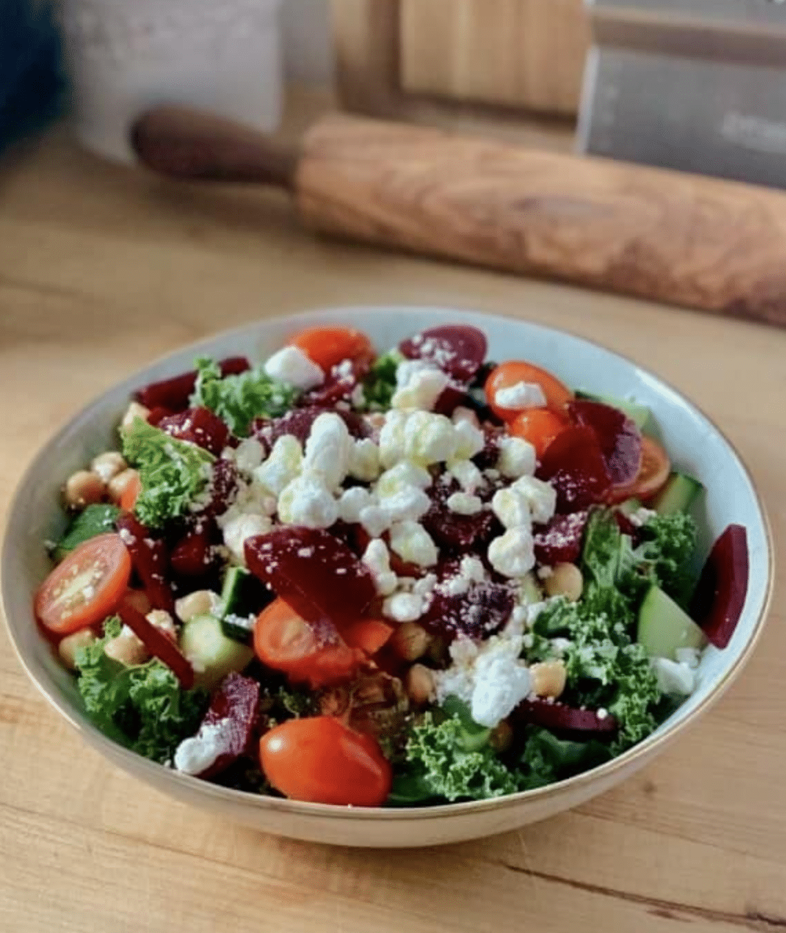 kale, vegetable salad with cheese in bowl