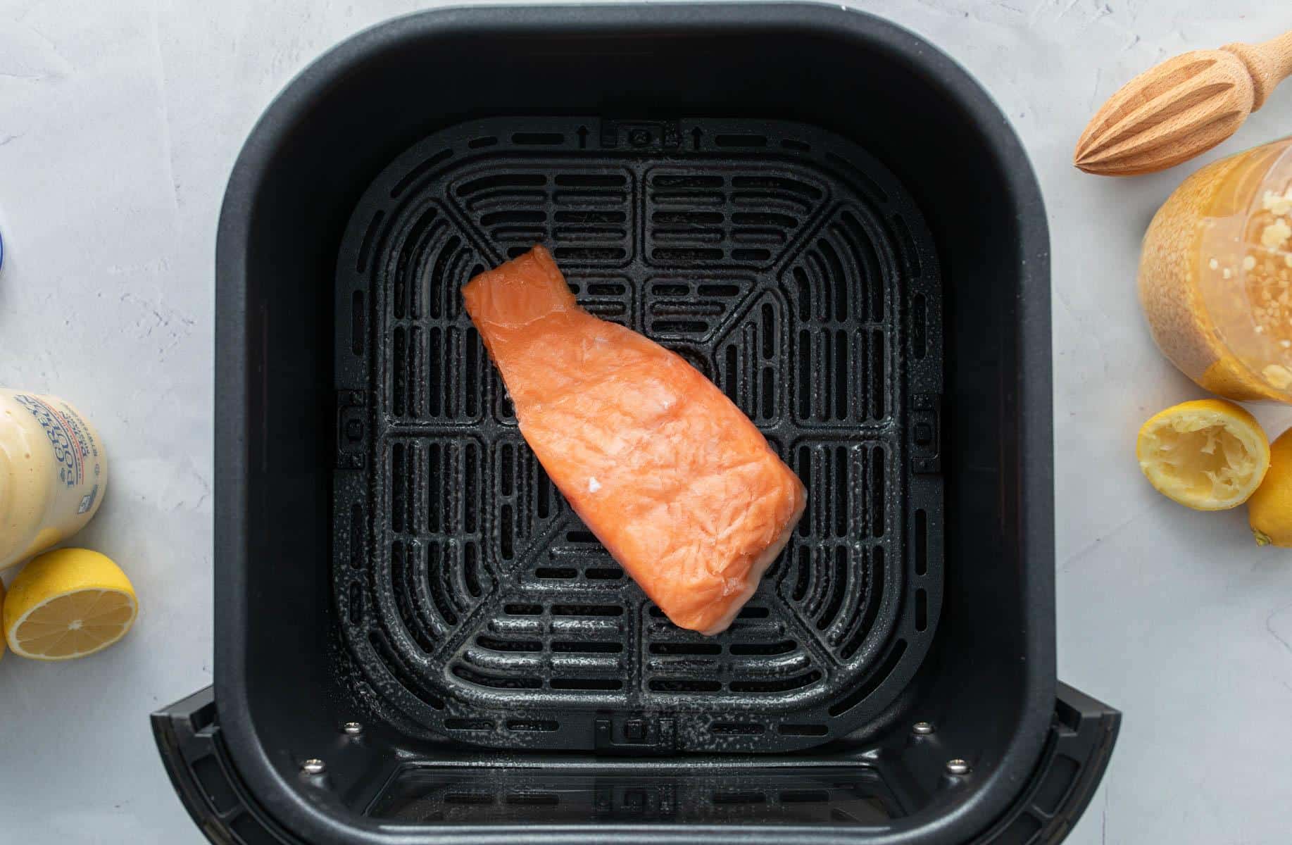 frozen salmon filet in air fryer basket