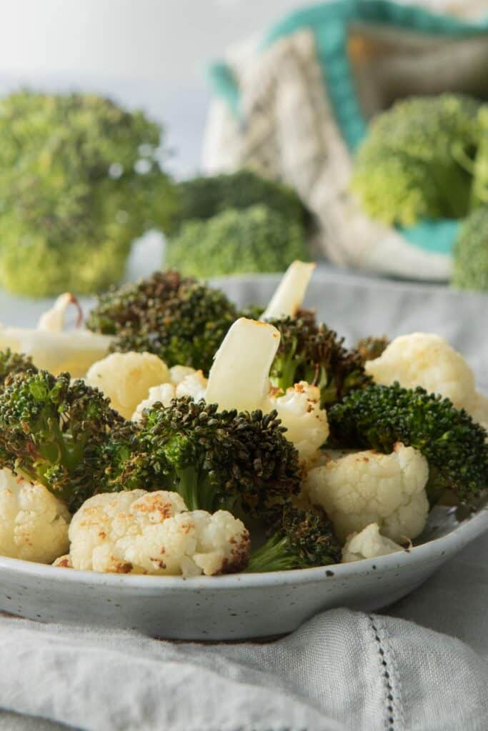 roasted stalks of broccoli and cauliflower on plate