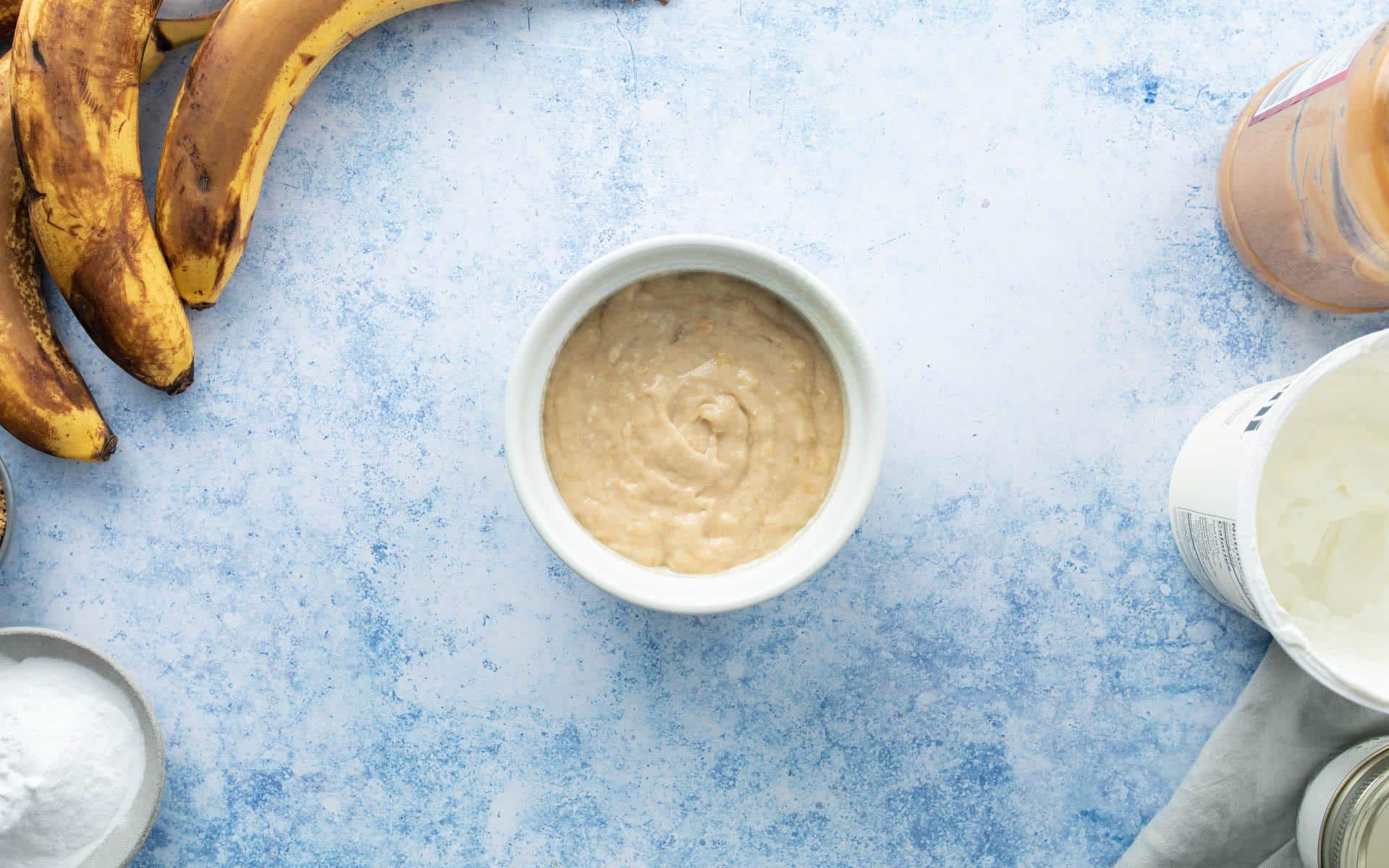 unbaked banana bread batter in white ramekin