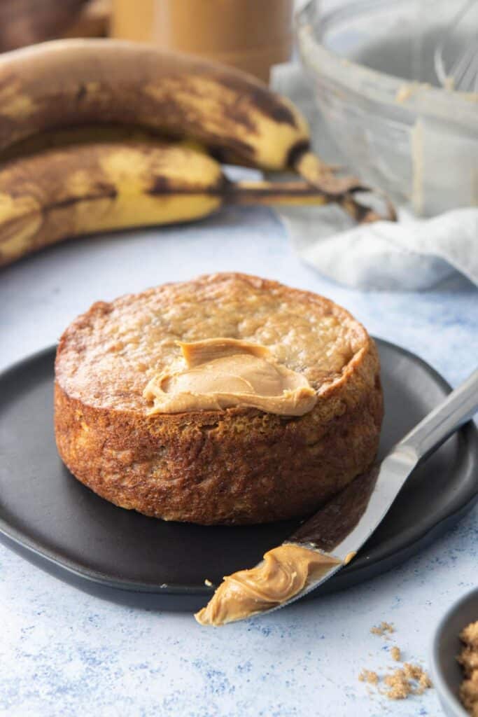 round banana bread with peanut butter and knife