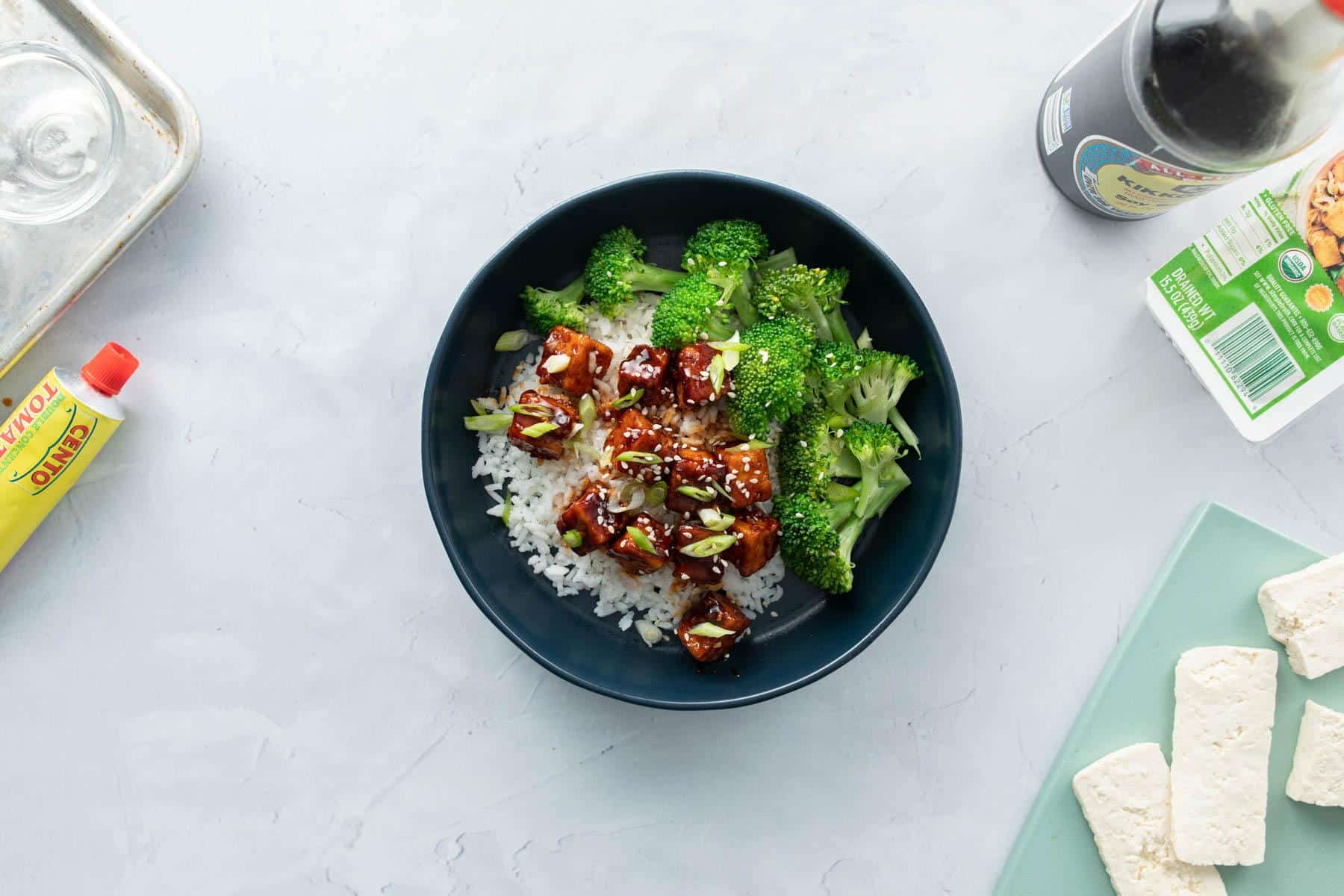 tofu cubes with sauce and broccoli over rice