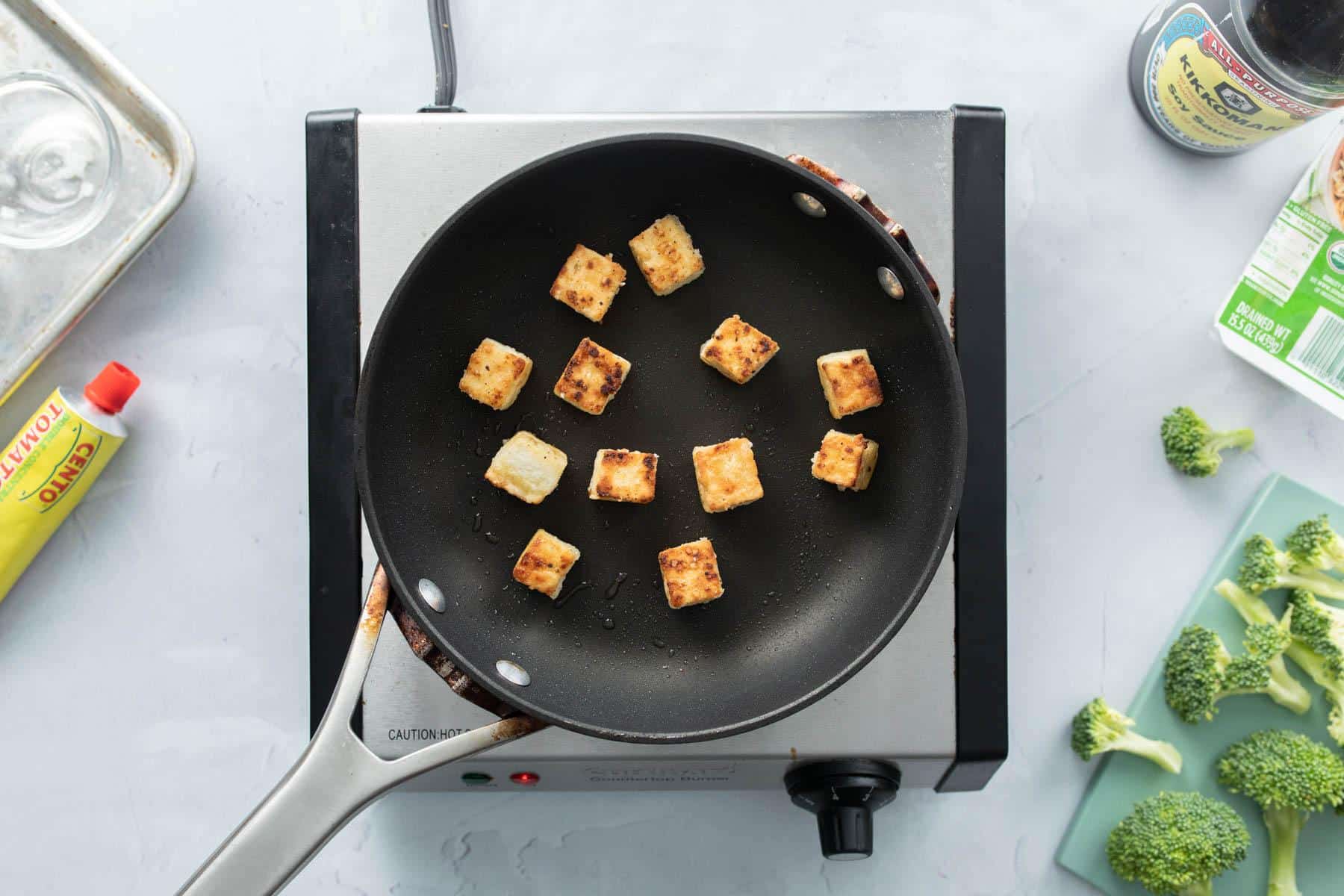 cooked tofu pieces in pan