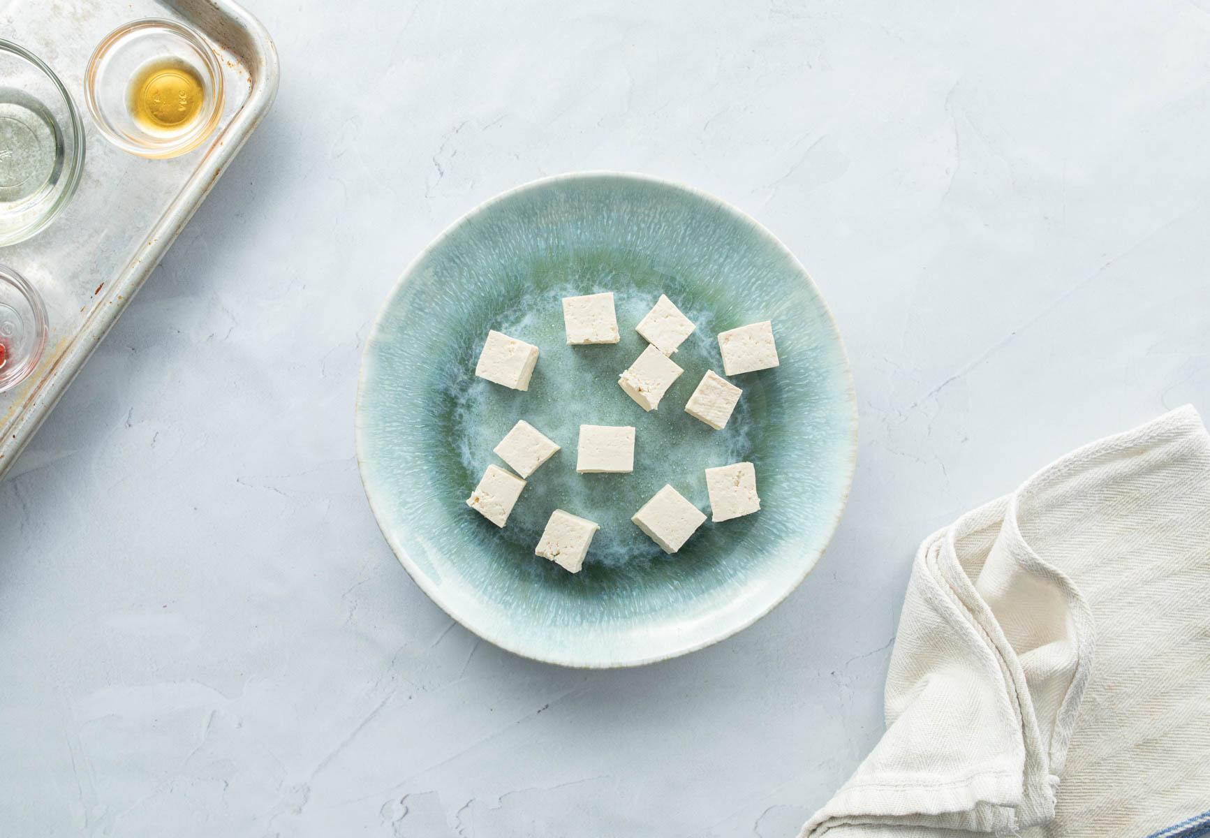 squares of tofu on blue plate
