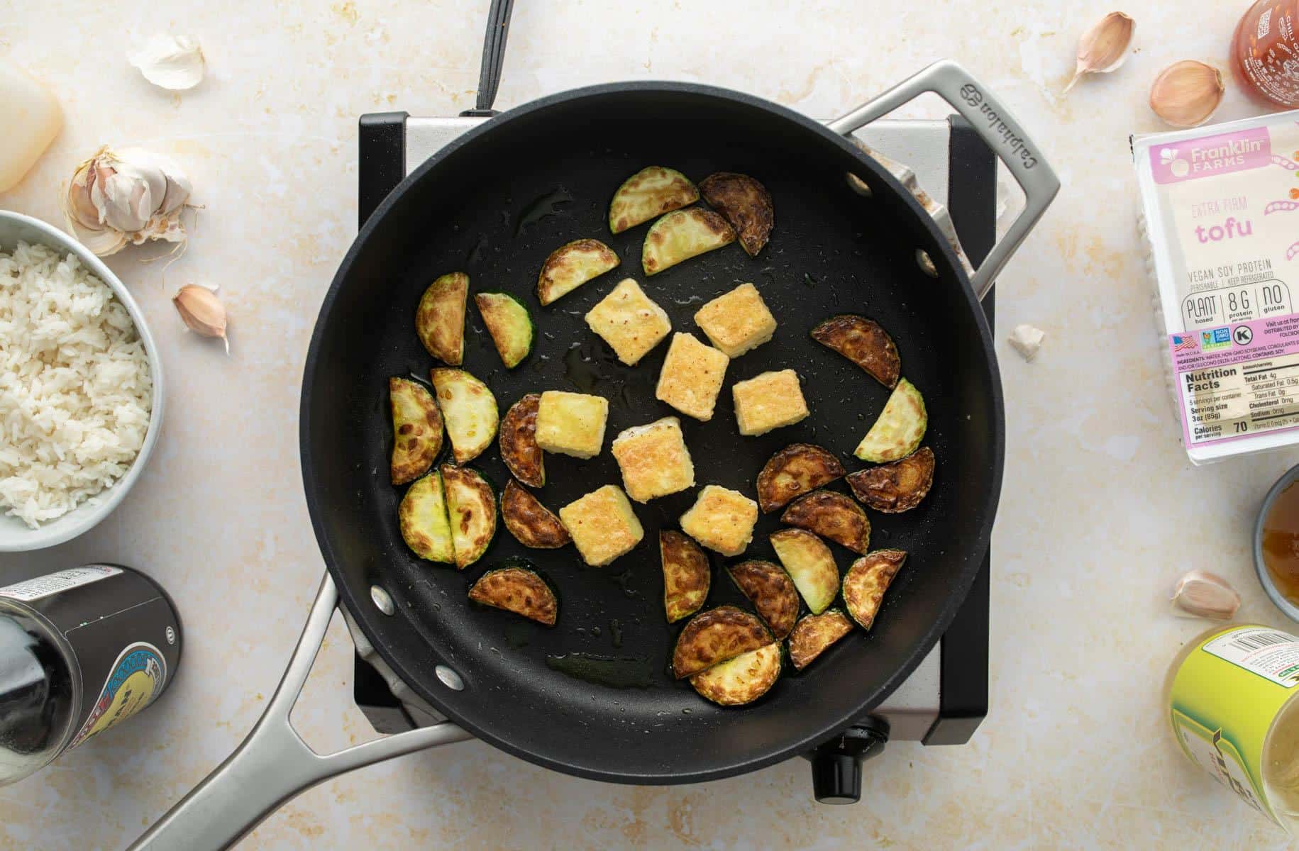 cooked tofu and zucchini in pan