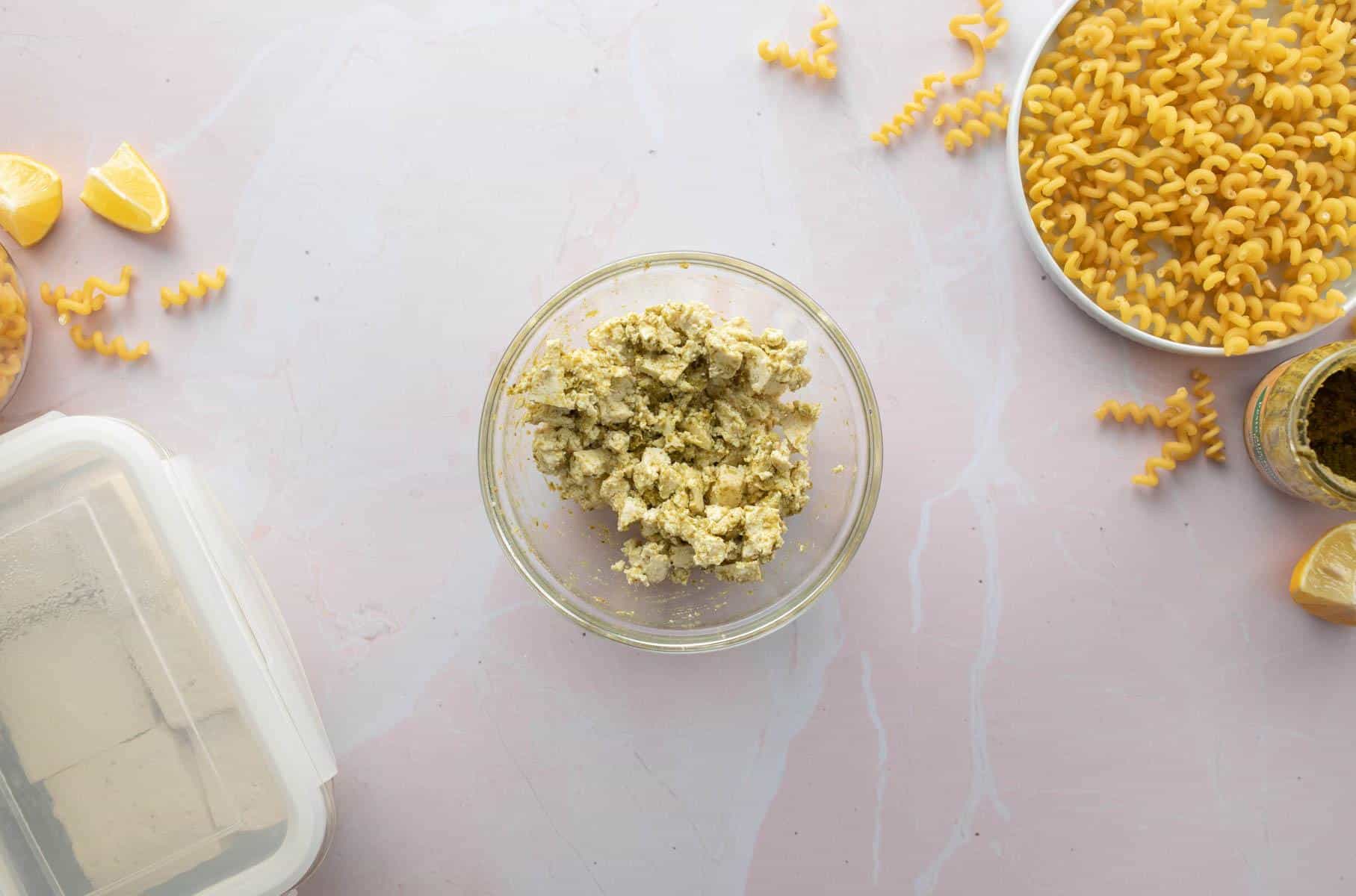 bowl of crumbled tofu with pesto