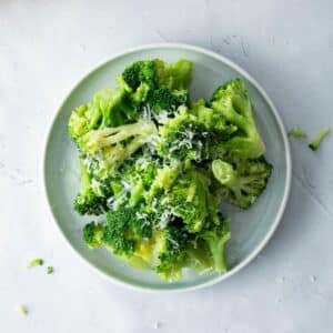 plate with cooked broccoli on it